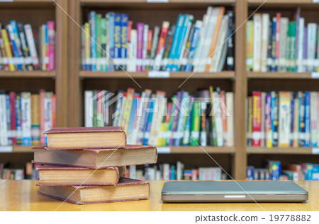 old book on the desk in library with tablet old book on the desk in library with tablet 19778882