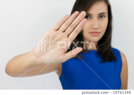 Young woman showing her denial with NO on her hand Young woman showing her denial with NO on her hand 19781349