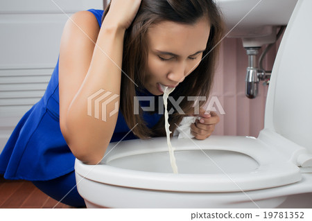 Beautiful adult woman vomiting in toilet Beautiful adult woman vomiting in toilet 19781352