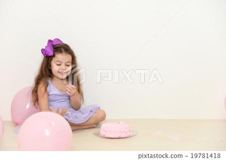 Girl looking at cake cream Girl looking at cake cream 19781418