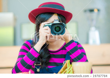 Hipter beautiful young woman with a camera 19787784