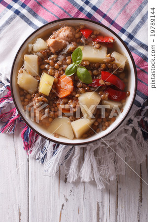 brown lentil soup with vegetables and meat closeup brown lentil soup with vegetables and meat closeup 19789144