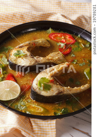 Indian fish curry with vegetables closeup Vertical 19789281