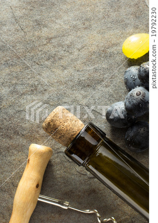 corkscrew and wine bottle with grape corkscrew and wine bottle with grape 19792230