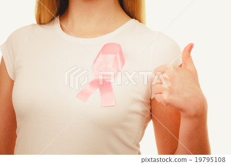 Closeup pink cancer ribbon on woman chest Closeup pink cancer ribbon on woman chest 19795108