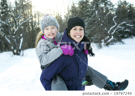 Mother and child girl on a winter in nature. 19797240