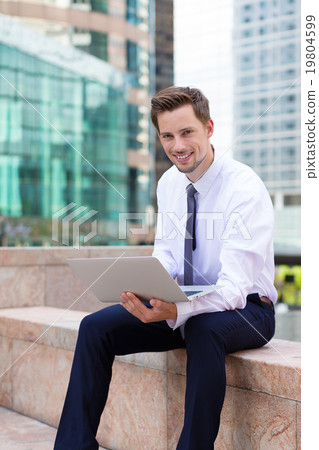 Caucasian young businessman use of the notebook computer Caucasian young businessman use of the notebook computer 19804599