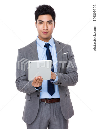 Asian young businessman use of the digital tablet Asian young businessman use of the digital tablet 19804601