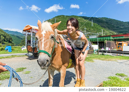 Woman with horse in farm 19804622