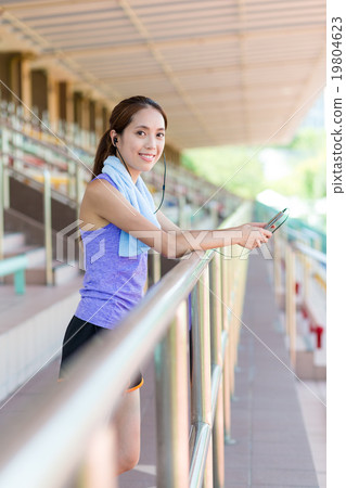 Woman enjoy the music after doing sport Woman enjoy the music after doing sport 19804623