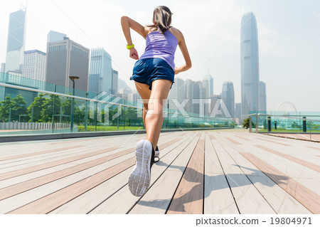 The back view of woman running in Hong Kong 19804971