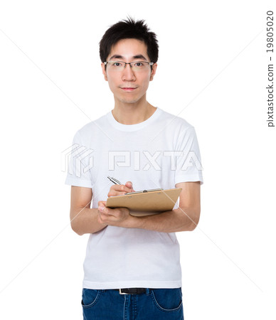 Asian man take note on clipboard Asian man take note on clipboard 19805020