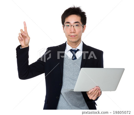 Businessman hold with laptop computer and finger point up Businessman hold with laptop computer and finger point up 19805072