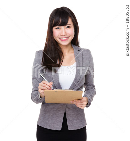 Young Businesswoman write on clipboard Young Businesswoman write on clipboard 19805553