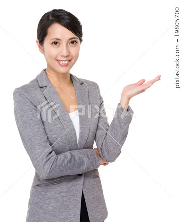 Young businesswoman with open hand palm Young businesswoman with open hand palm 19805700