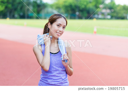 Woman using towel after doing exercise Woman using towel after doing exercise 19805715
