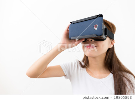 Virtual Reality headset on woman playing video games Virtual Reality headset on woman playing video games 19805898