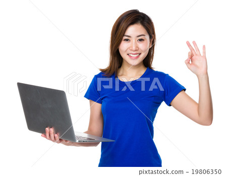 Woman use of laptop and ok sign Woman use of laptop and ok sign 19806350