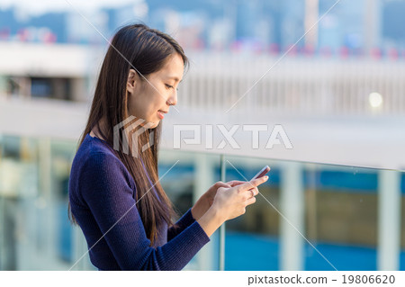 Woman read the message on cellphone 19806620