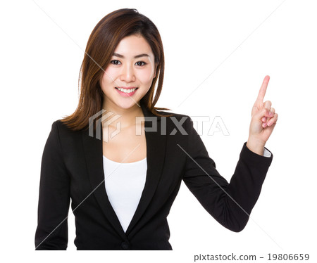 Young businesswoman with finger point up Young businesswoman with finger point up 19806659