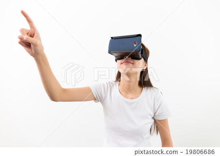 Woman wear with with VR device and finger touch in air Woman wear with with VR device and finger touch in air 19806686