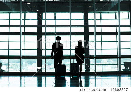 Business: Male and female colleagues in overseas business trip air suit 19808827