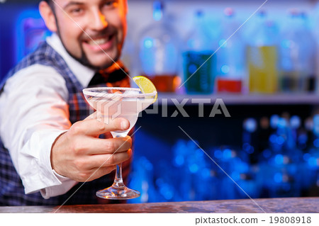 Barman at work, preparing cocktails. 19808918