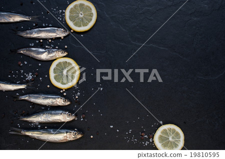 Small fishes with lemon on the table Small fishes with lemon on the table 19810595