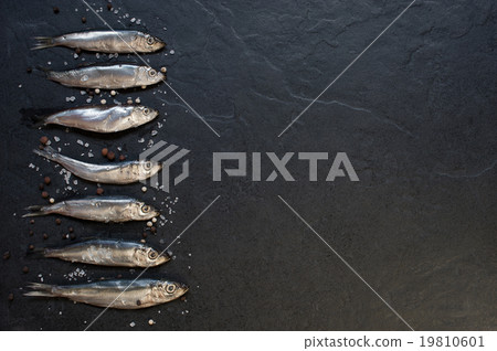 Small fishes with salt and pepper on the table 19810601