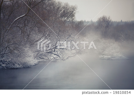 Misty winter river. Winter fog ober the river. Misty winter river. Winter fog ober the river. 19810854