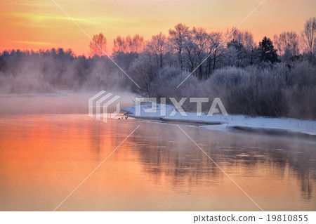 Misty winter dawn on the river. Misty winter dawn on the river. 19810855