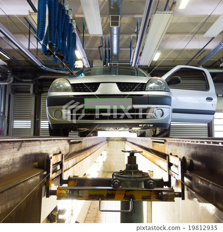 Car on service platform in garage. Car on service platform in garage. 19812935