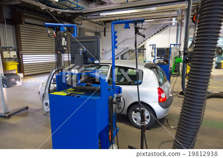 Car waiting for technical review in garage. Car waiting for technical review in garage. 19812938