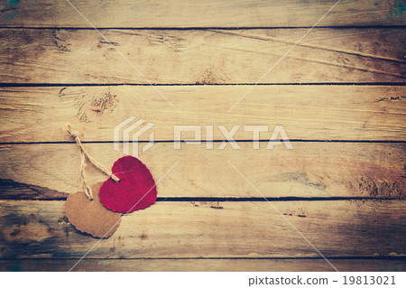 Two red and brown heart on wooden background Two red and brown heart on wooden background 19813021