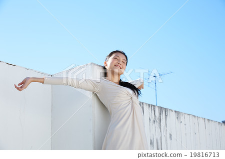 A beautiful woman with blue sky and skin 19816713