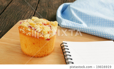 Delicious blueberry muffin on old wooden planks 19816919