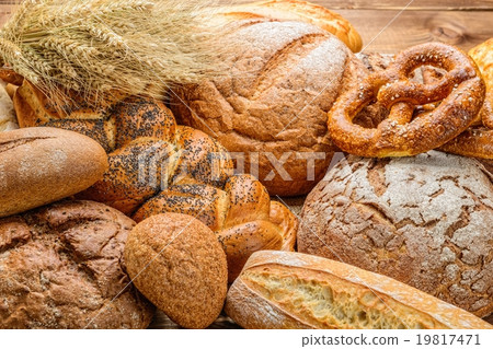 fresh bread  and wheat on the wooden 19817471