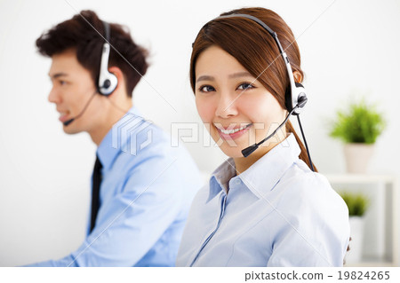 Stock Photo: businesswoman and businessman with headset working in office