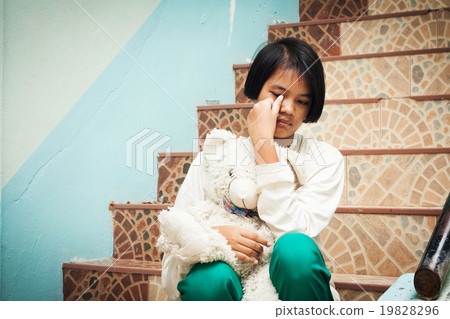 girl sitting alone at staircase in the park girl sitting alone at staircase in the park 19828296