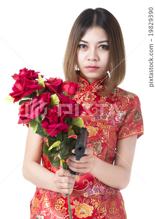Beautiful woman with gun and flower 19829390