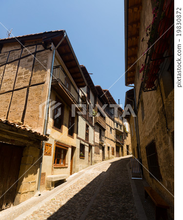 Old narrow street with typical houses in Frias. Burgos 19830872