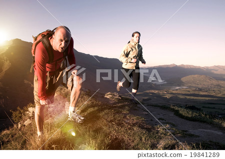 Extreme Athletes Exercising in the Mountains Concept Extreme Athletes Exercising in the Mountains Concept 19841289