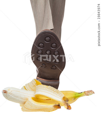 leg in left brown shoe stepping on banana peel leg in left brown shoe stepping on banana peel 19843974