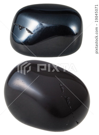 two Black Onyx gemstones isolated 19845071