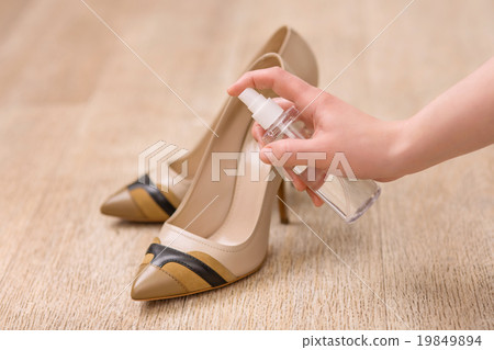 Good woman taking care of her shoes Good woman taking care of her shoes 19849894