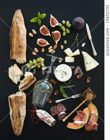 Wine and snack set. Baguette, glass of white, figs Wine and snack set. Baguette, glass of white, figs 19850795