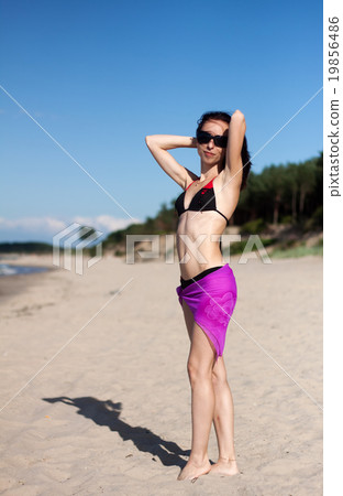 young beautiful woman on the beach young beautiful woman on the beach 19856486