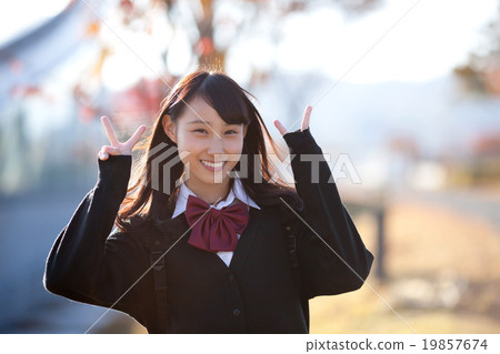 Dusk in autumn and school girls after school Dusk in autumn and school girls after school 19857674