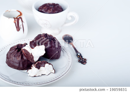 Chocolate  zephyr and cup of coffee  19859831