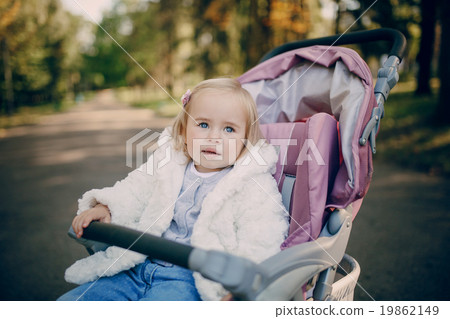 young family walking in the park 19862149
